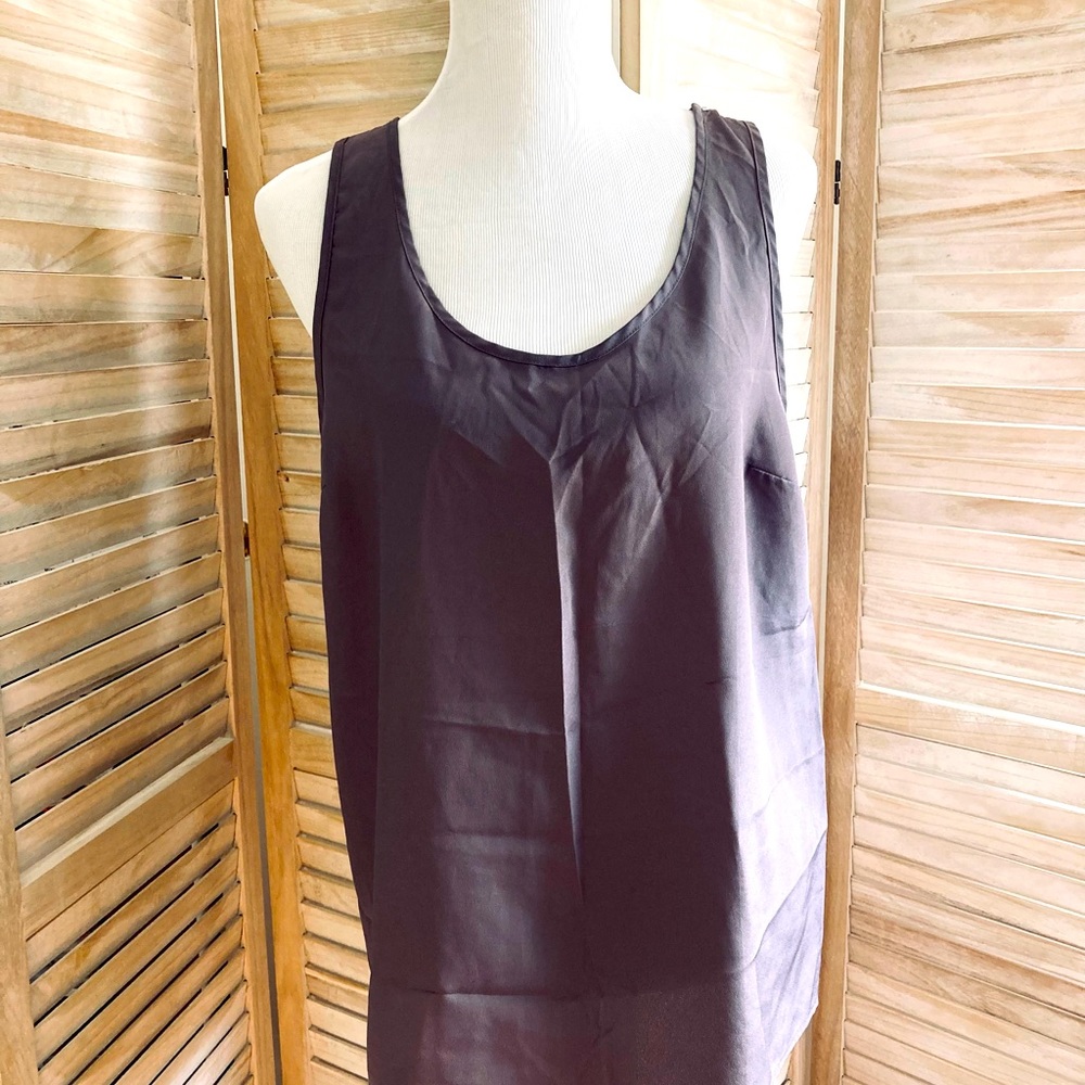 Sleeveless tan top.